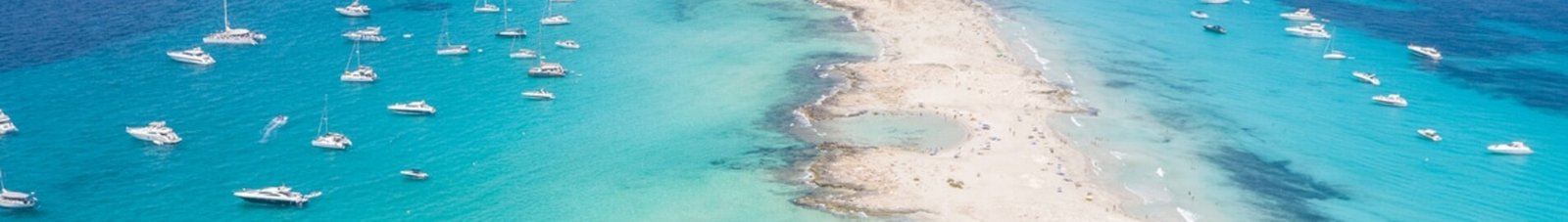 Formentera aerial view of turquoise water and yachts anchored