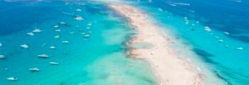Formentera aerial view of turquoise water and yachts anchored